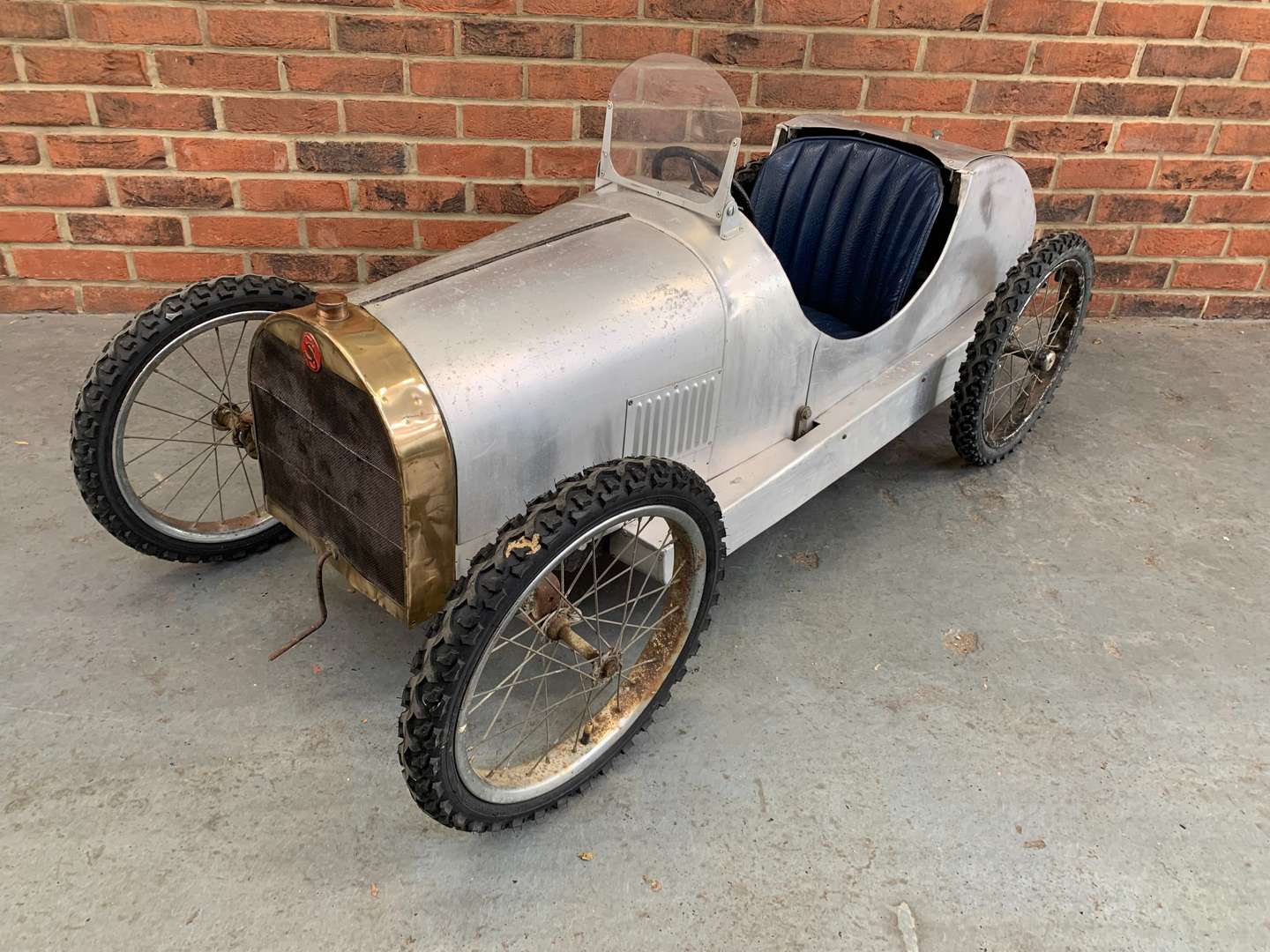 <p>Bugatti Styled Aluminium Bodied Made Child's Pedal Car</p>
