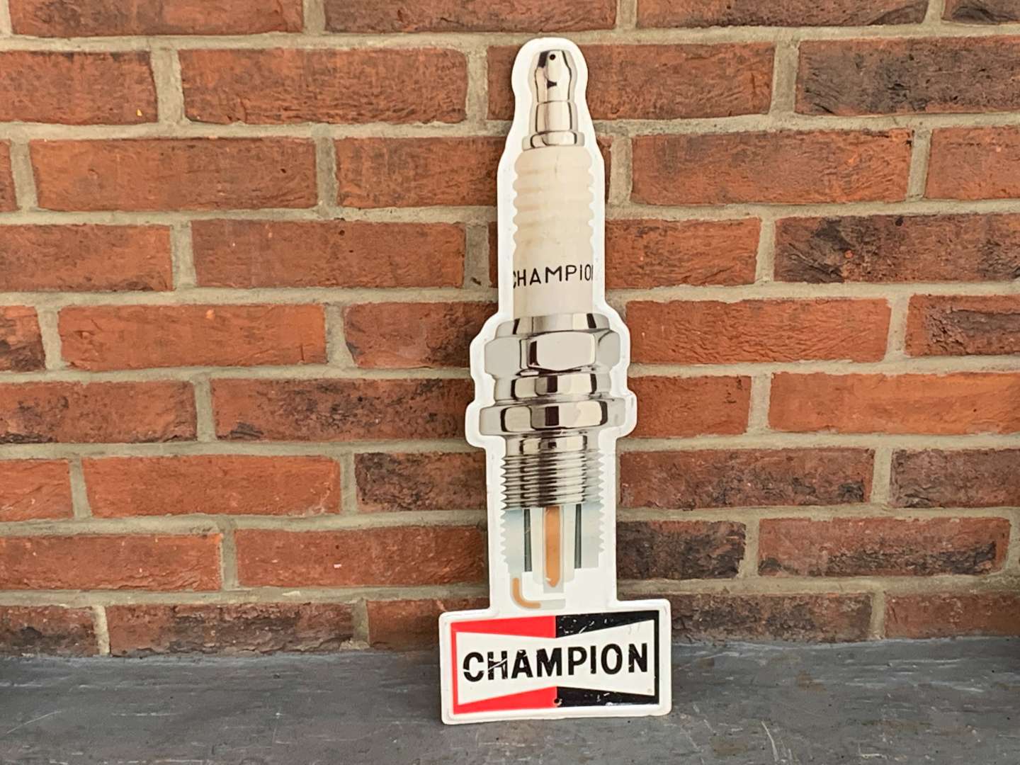 <p>Champion Spark Plug Tin Sign</p>