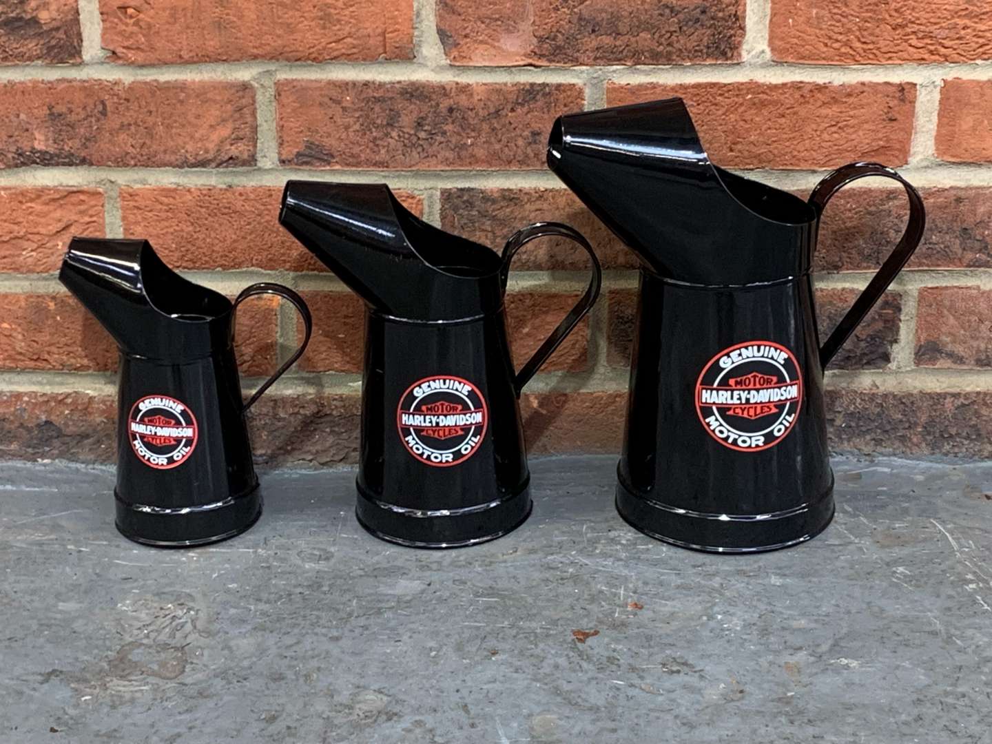<p>Three Modern Harley-Davidson Oil Jugs</p>