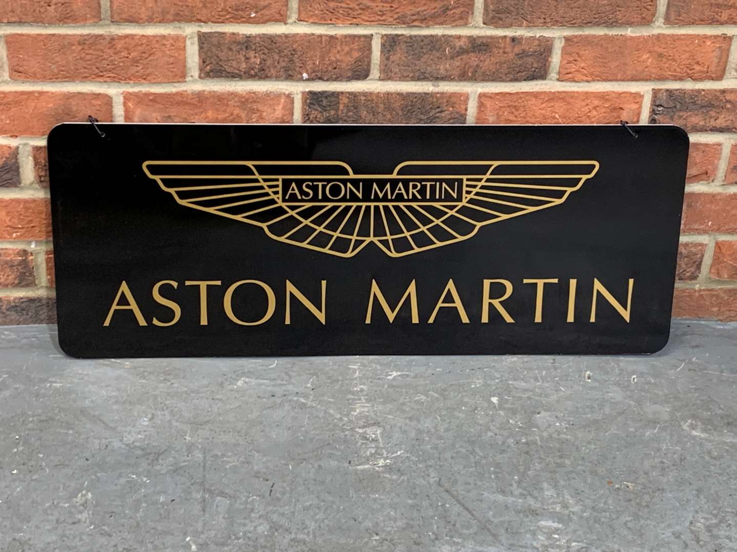 <p>Aston Martin Metal Hanging Sign</p>