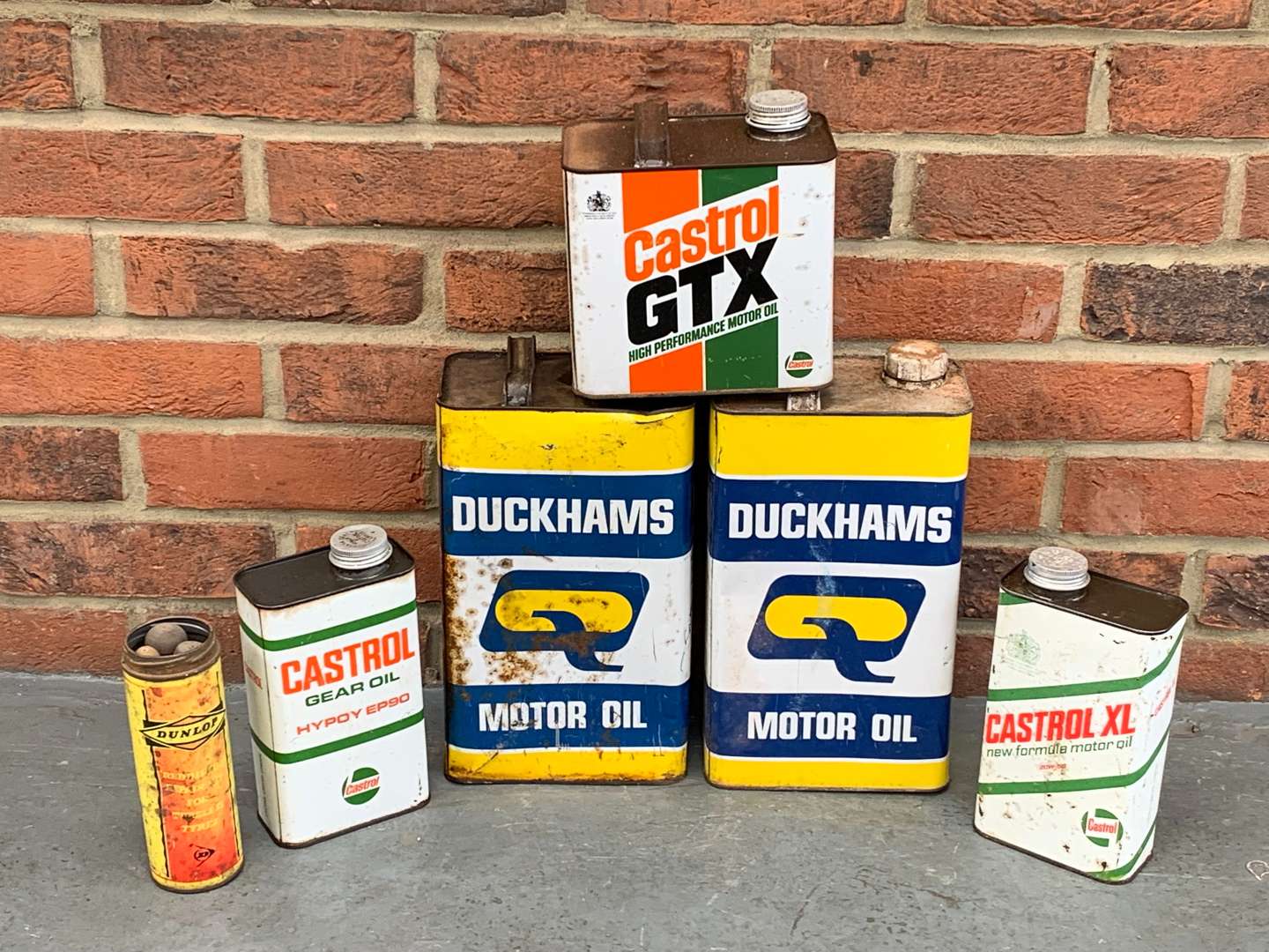 <p>Six Duckhams and Castrol Oil Cans</p>