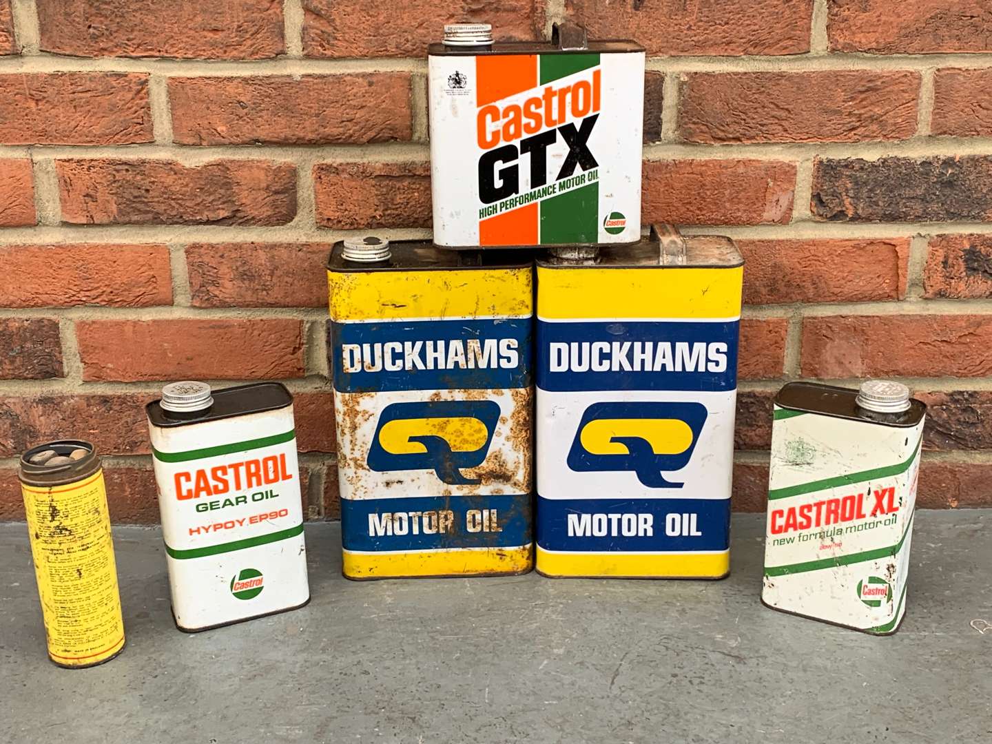 <p>Six Duckhams and Castrol Oil Cans</p>