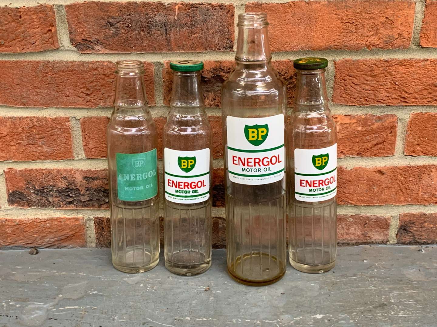 <p>Four BP Energol Glass Motor Oil Bottles</p>