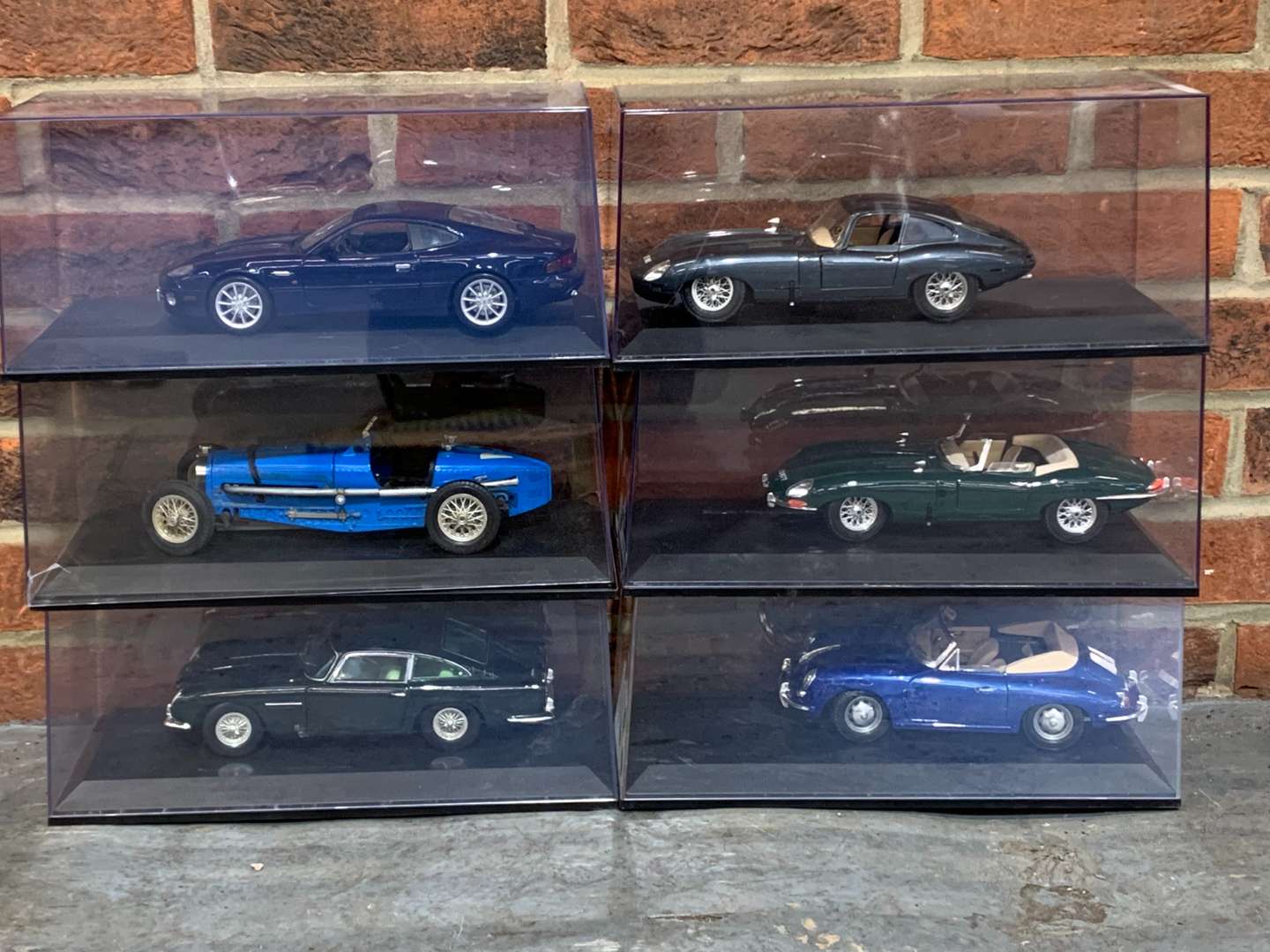 <p>Six 1:18 Scale Cased Model Cars</p>