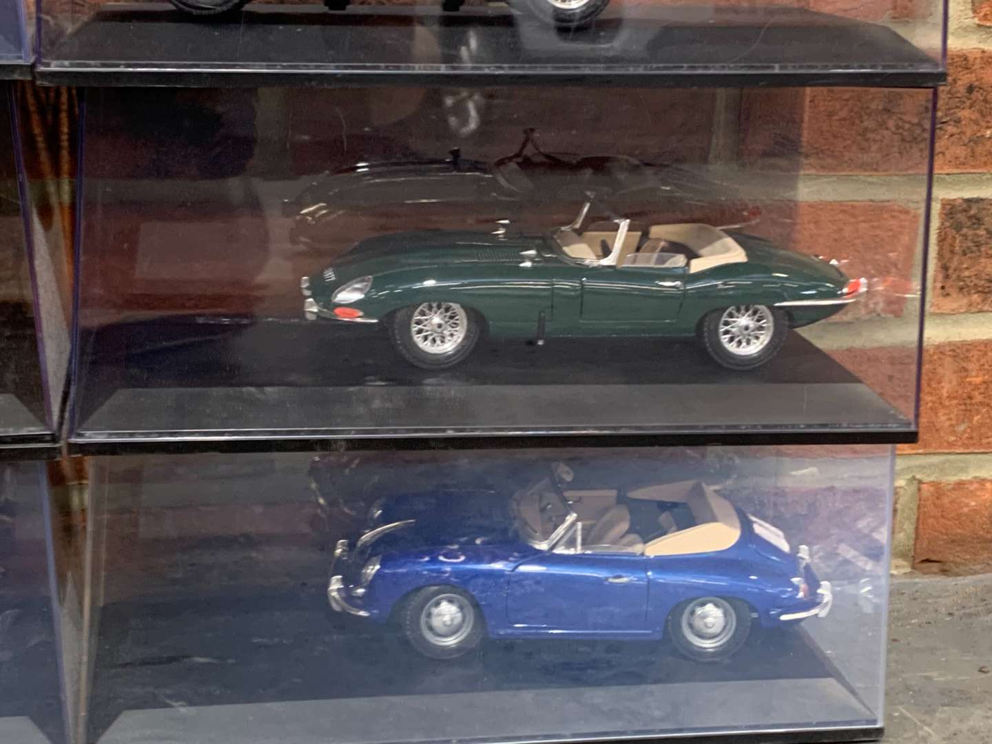 <p>Six 1:18 Scale Cased Model Cars</p>