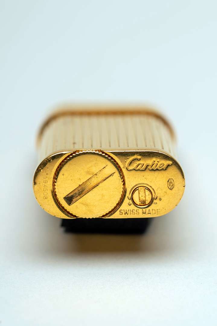 <p>Cartier lighter gold plated</p>