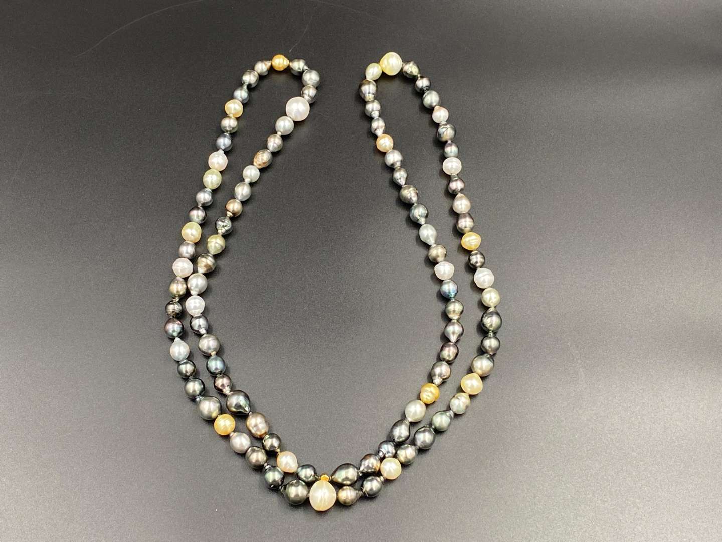 <p>SCHOEFFEL, a signed, single strand of colored freshwater pearls.</p>