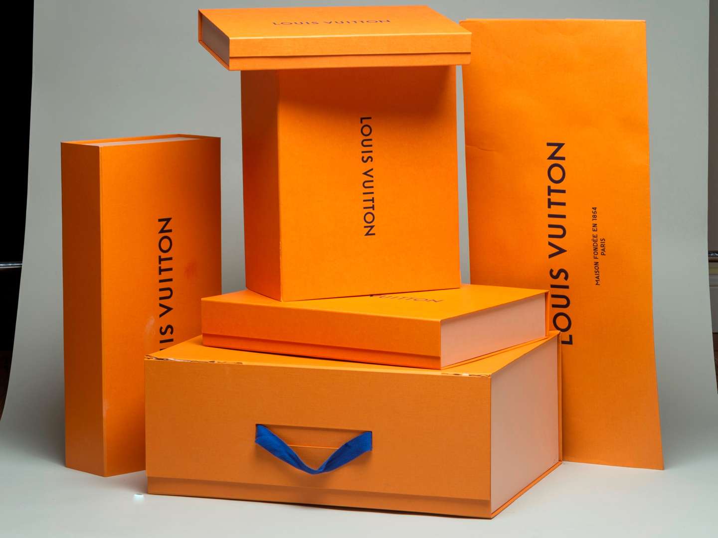 <p>Selection of Louis Vuitton boxes and bag</p>