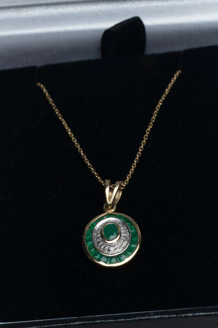 <p>Emerald and diamond pendant with chain</p>