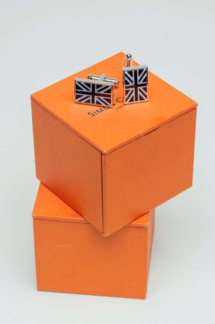 <p>Two pairs of Simon Carter Onyx and MOP Union Jack Cufflink</p>