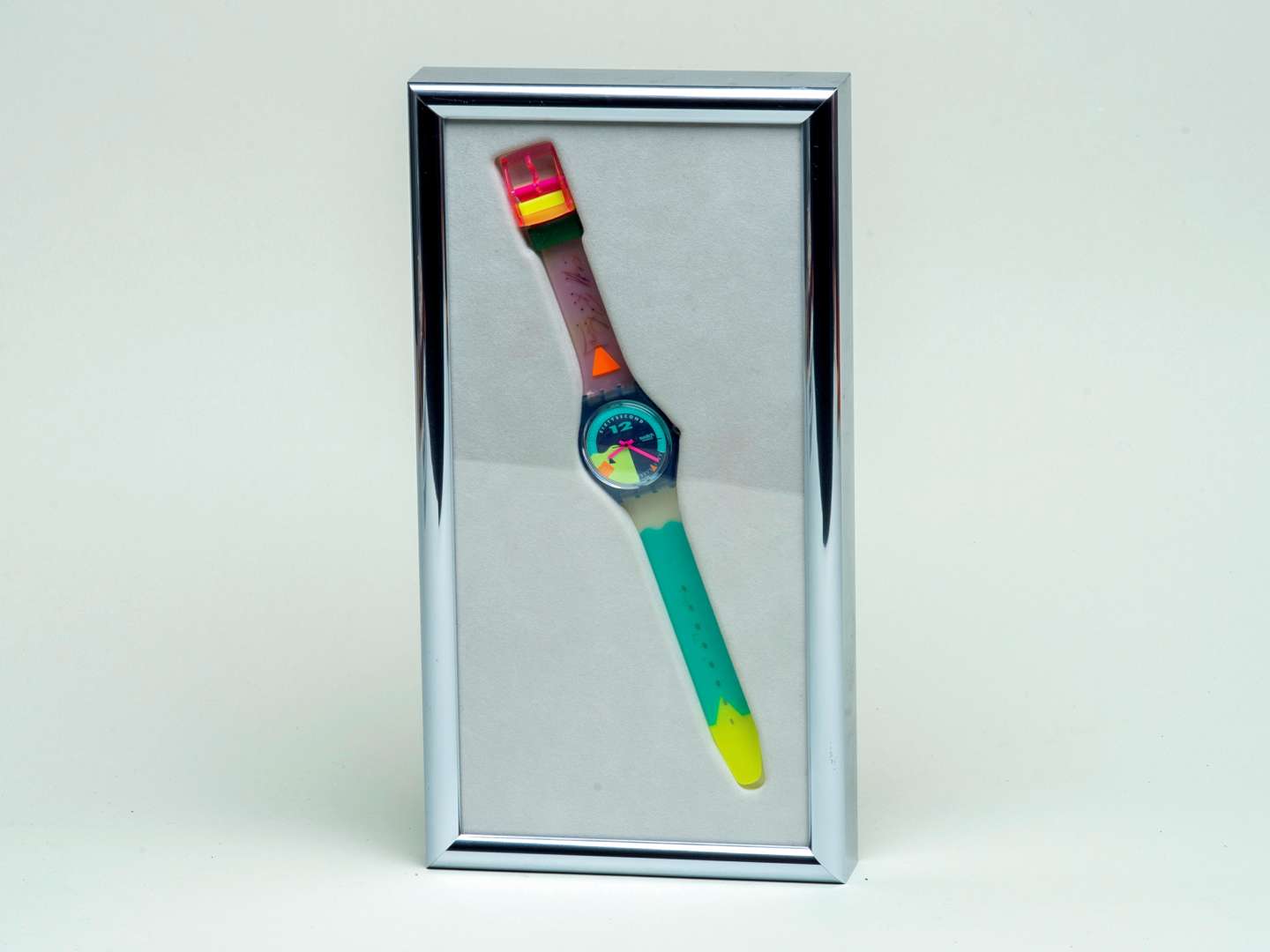 <p>"Nose Wheely" framed “Cliff Richard” signed Swatch watch</p>