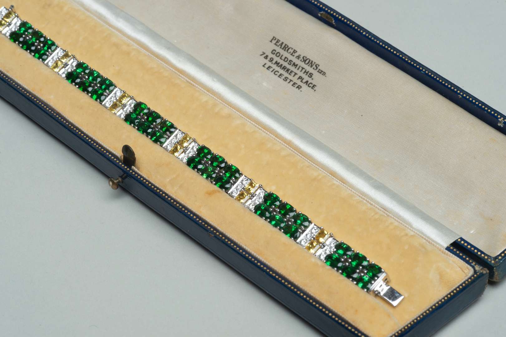 <p>Princess cut yellow sapphires, diamonds and chrome tourmalines 18ct gold bracelet</p>