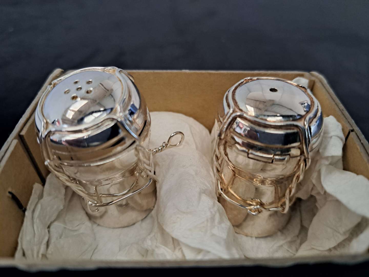 <p>Silver “champagne corks” salt and pepper pots</p>