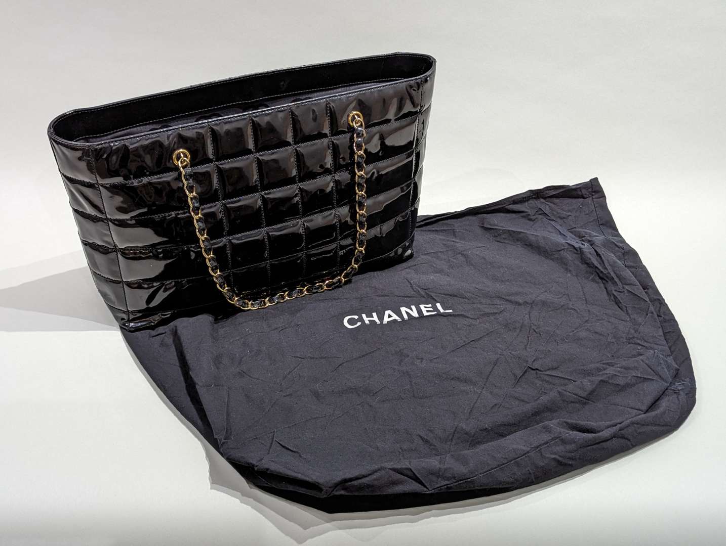 <p>Chanel vintage quilted patent chocolate bar tote</p>