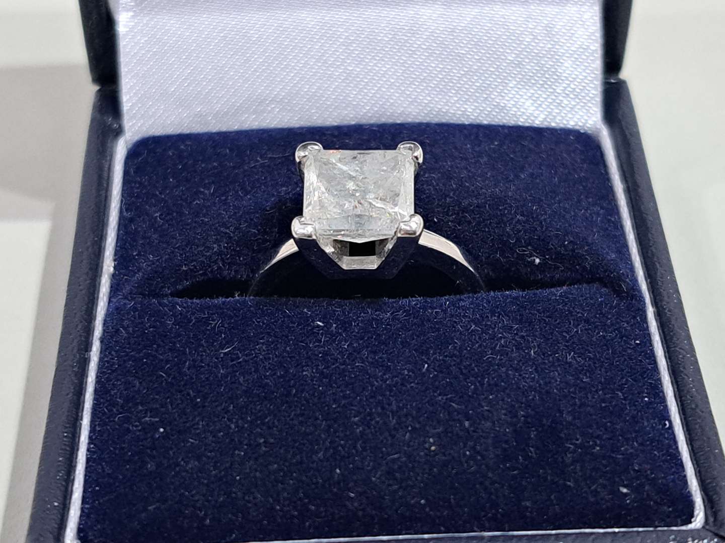 <p>14ct white gold solitaire claw set princess cut Diamond ring</p>