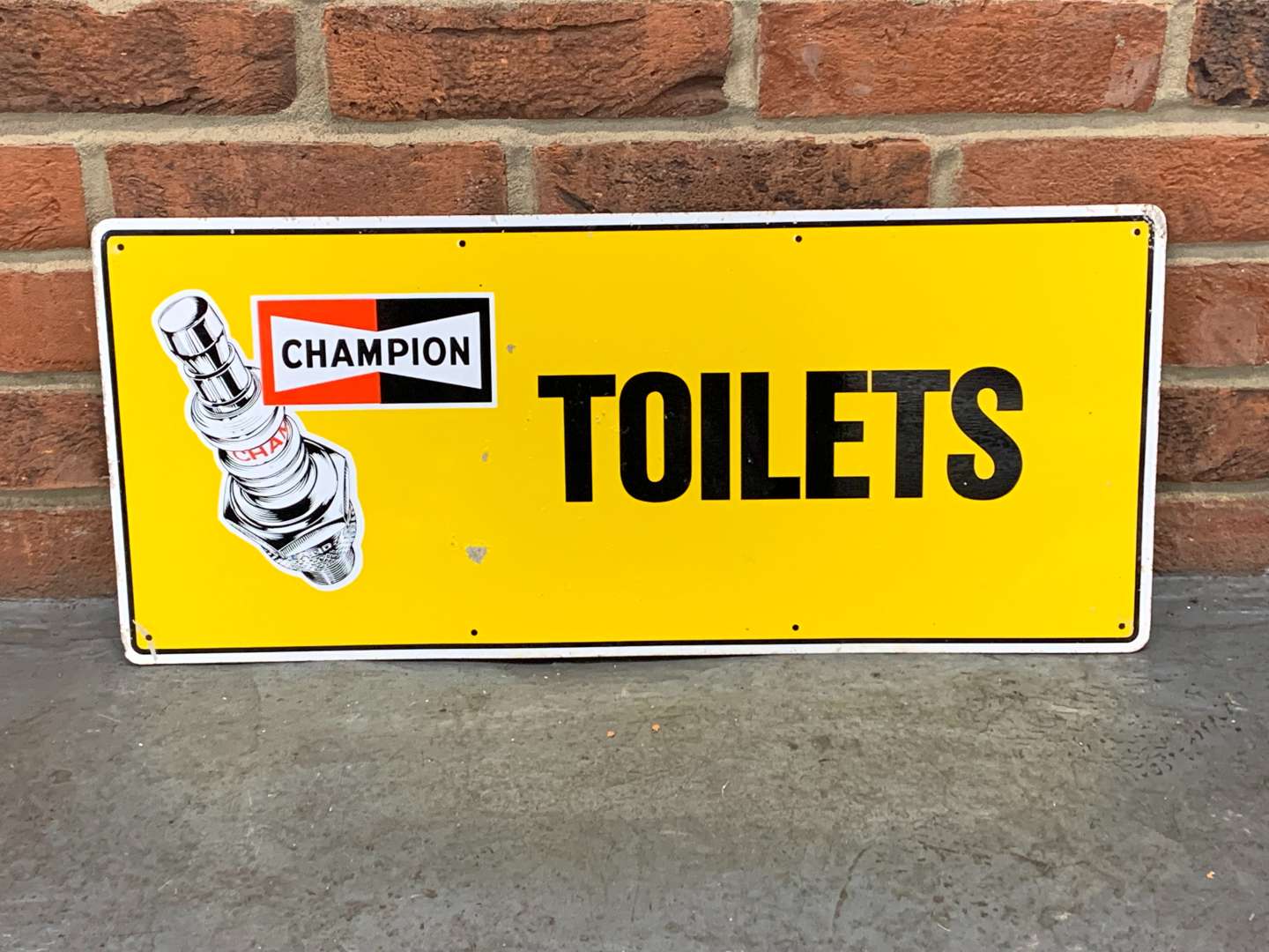 <p>Champion Spark Plug Toilets Sign</p>