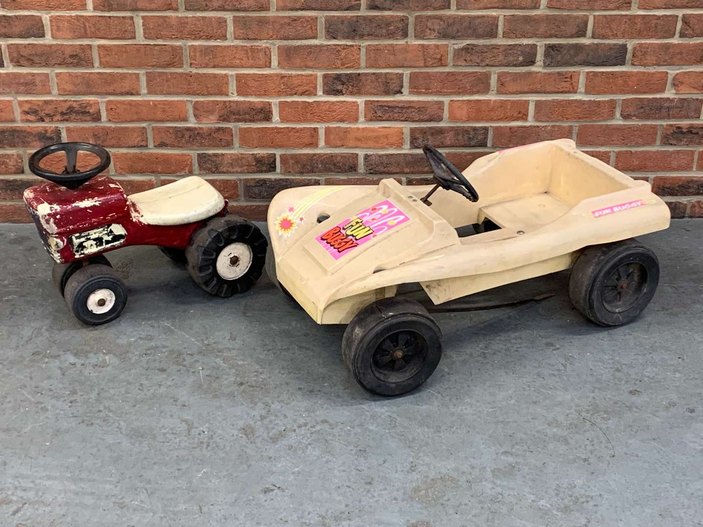 <p>Plastic Child's “Fun Buggy” and Pedal Tractor (2)</p>