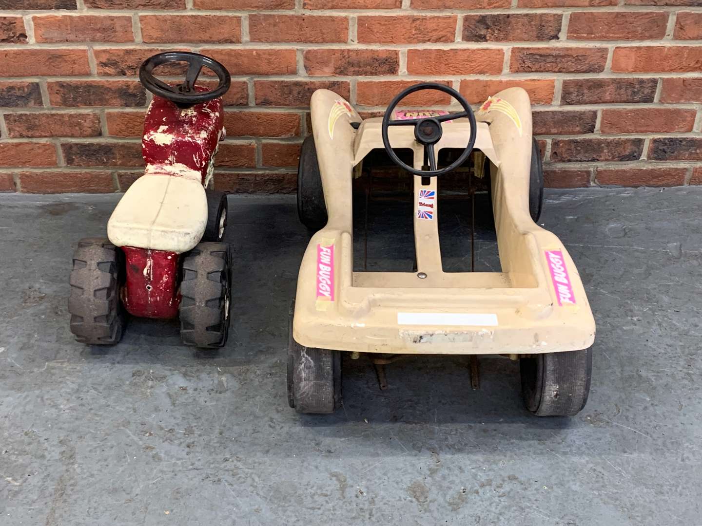 <p>Plastic Child's “Fun Buggy” and Pedal Tractor (2)</p>