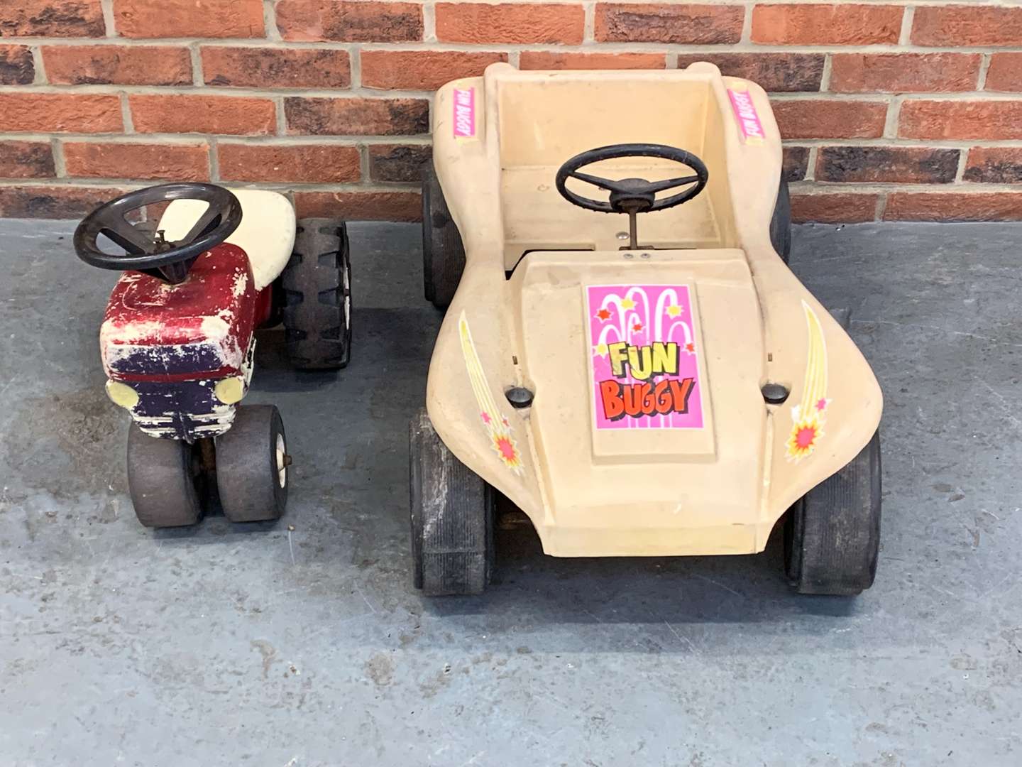 <p>Plastic Child's “Fun Buggy” and Pedal Tractor (2)</p>