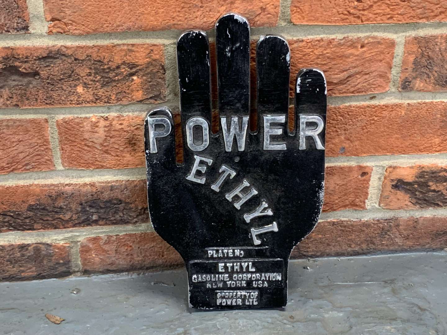 <p>Power Ethyl Cast Aluminium Hand Sign</p>