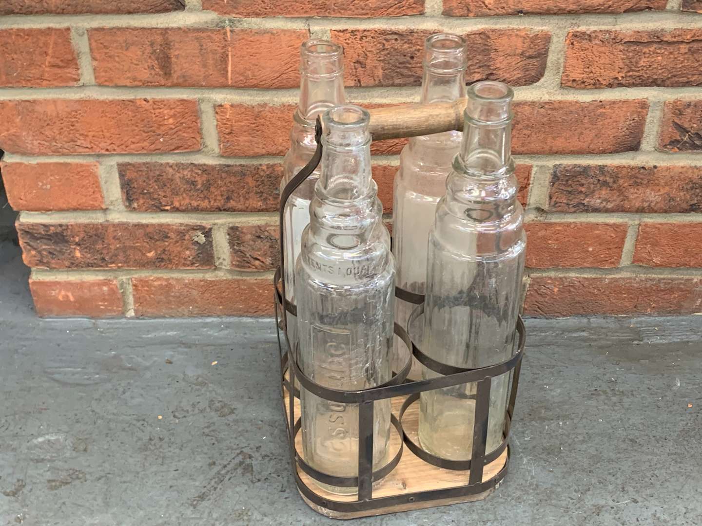 <p>Four Glass Esso Oil Bottles and Holder</p>