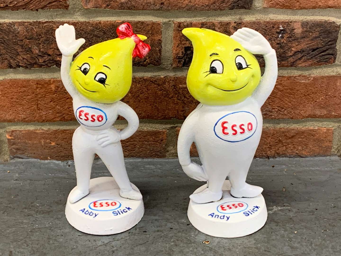 <p>Cast Iron Esso Andy and Abby Slick Figures</p>