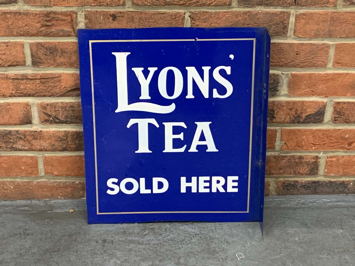<p>Lyons Tea Sold Here Made Flange Sign</p>