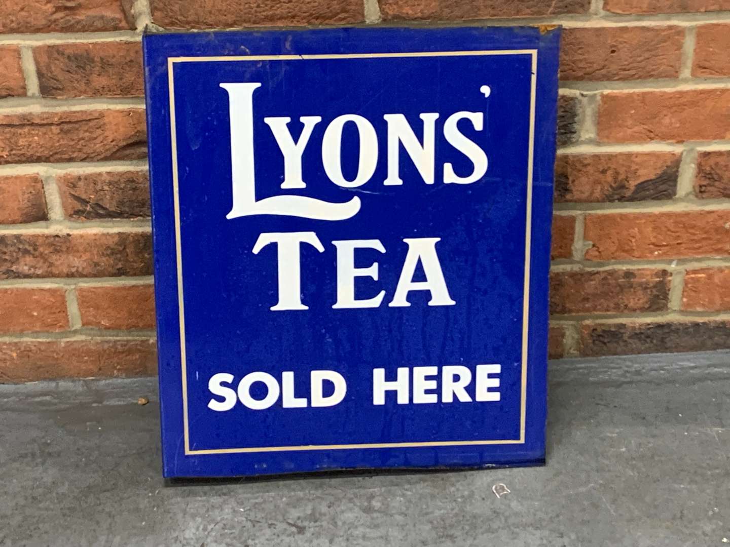 <p>Lyons Tea Sold Here Made Flange Sign</p>