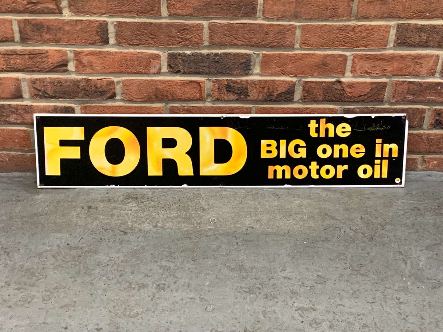 <p>Metal Ford “The Big One in Motor Oil” Sign</p>