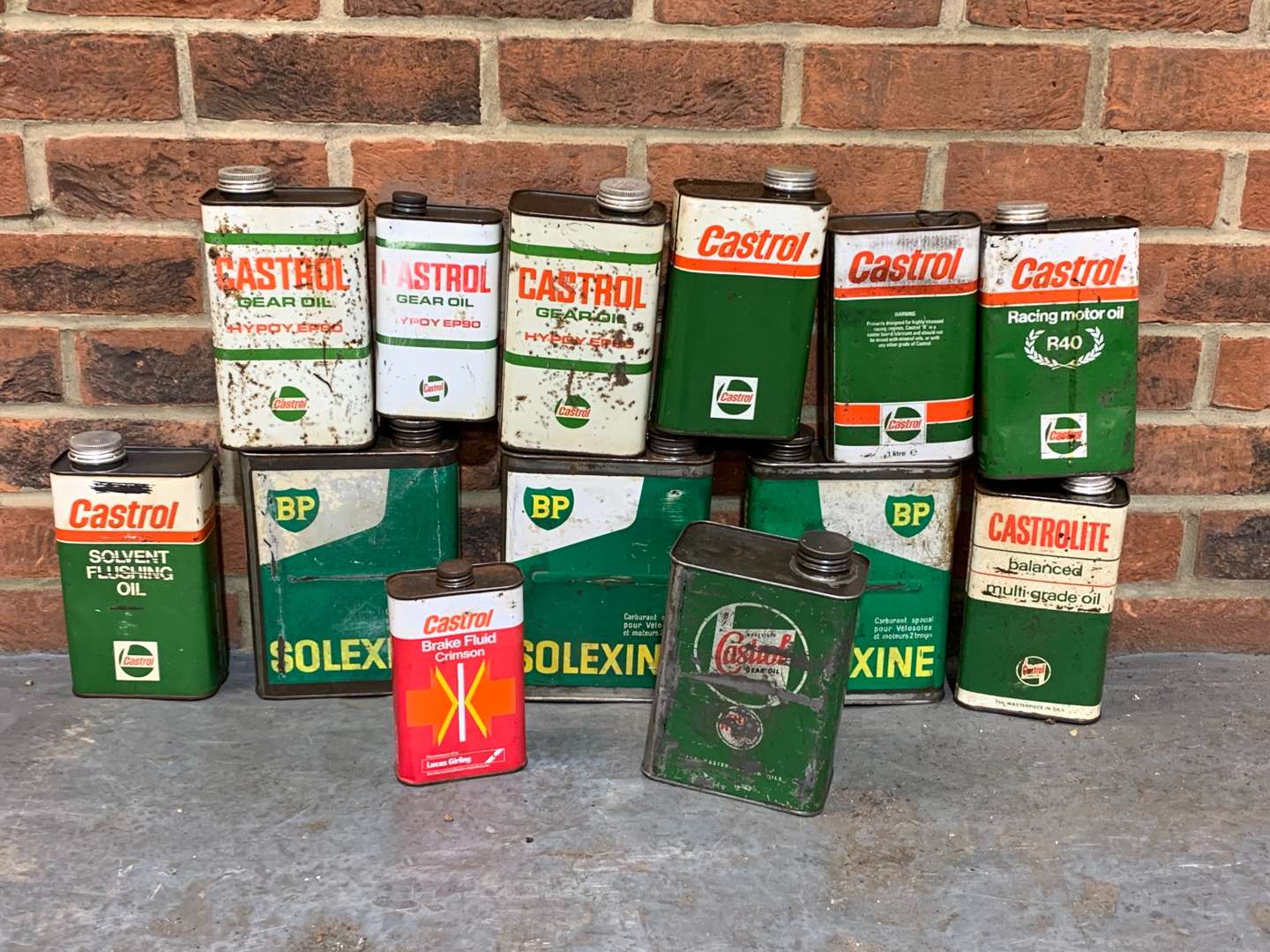 <p>Thirteen Castrol and BP Oil Cans</p>