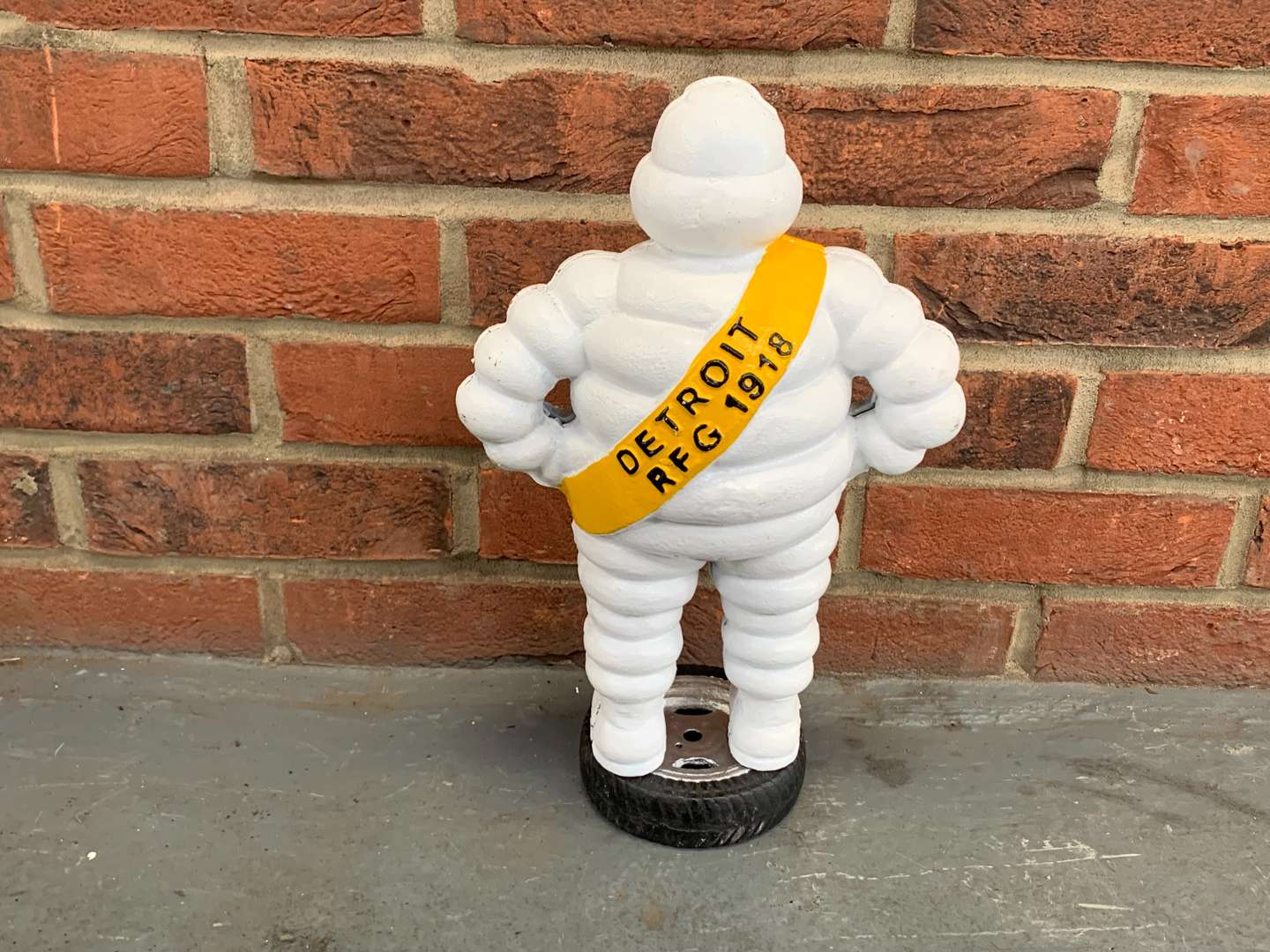 <p>Michelin Man Standing On A Tyre Cast Iron Figure</p>