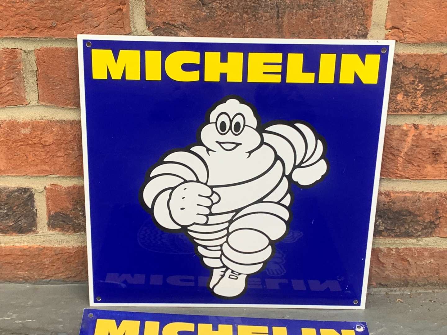 <p>Two Small Michelin Signs</p>