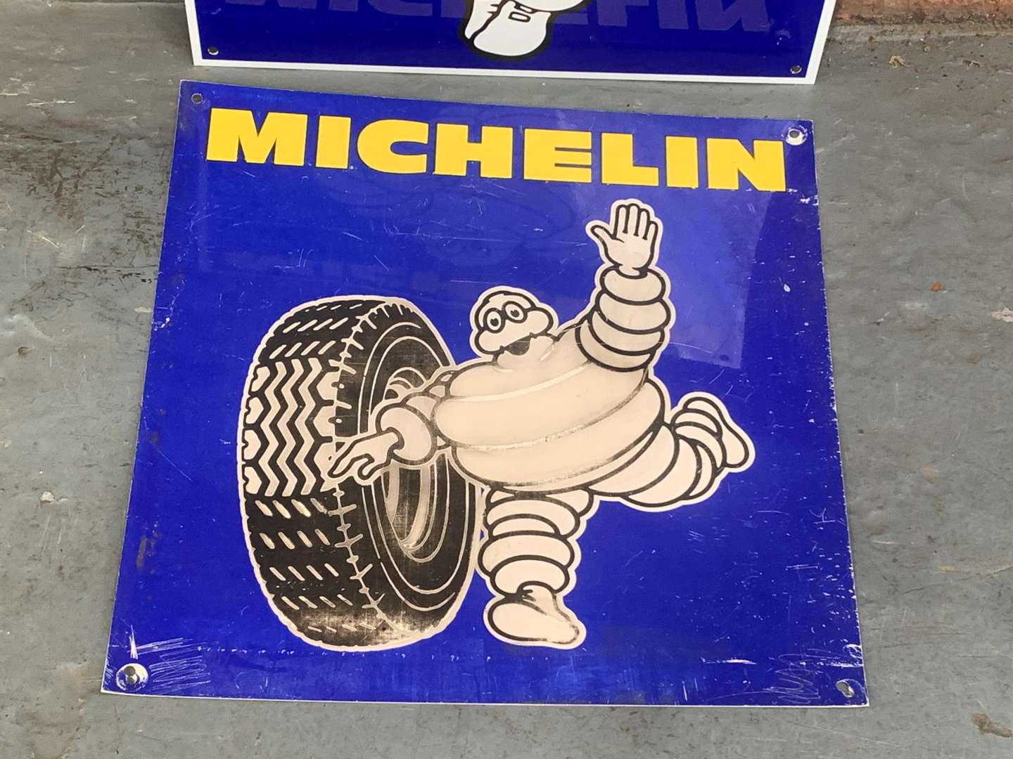 <p>Two Small Michelin Signs</p>