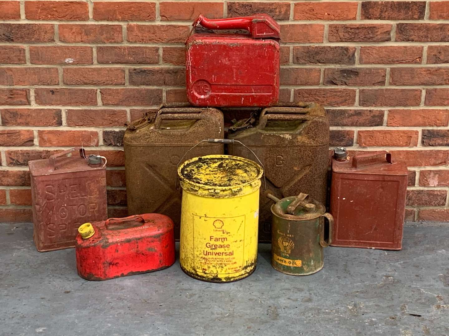 <p>Eight Vintage Oil and Fuel Cans</p>