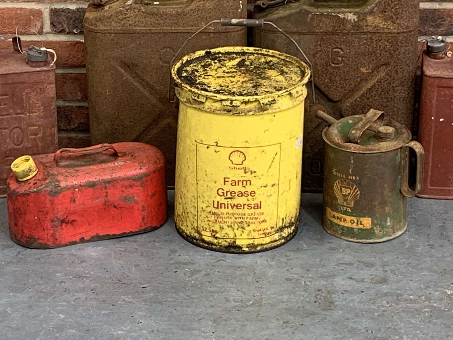 <p>Eight Vintage Oil and Fuel Cans</p>
