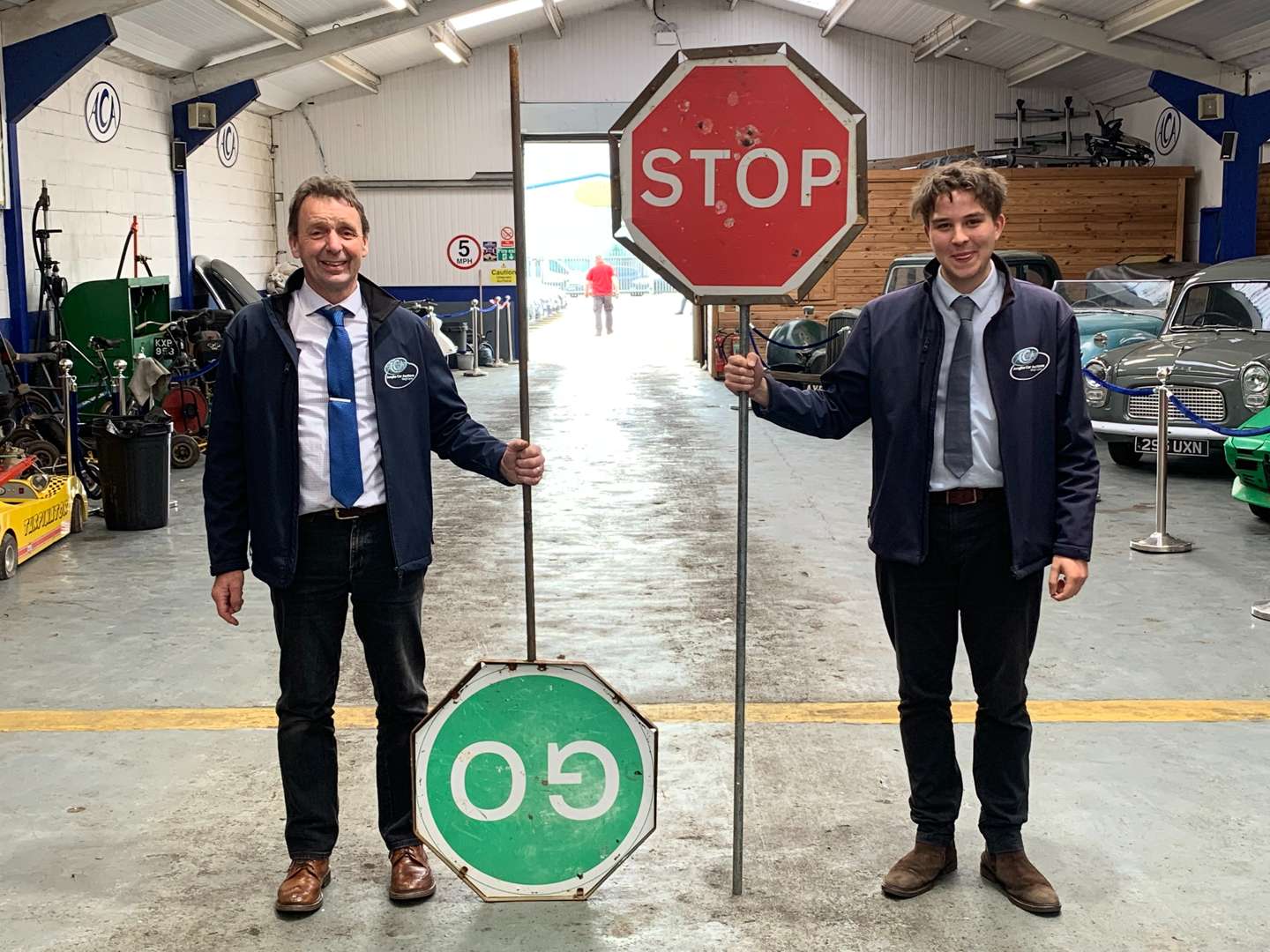 <p>Two Workmans Stop/GO Signs</p>