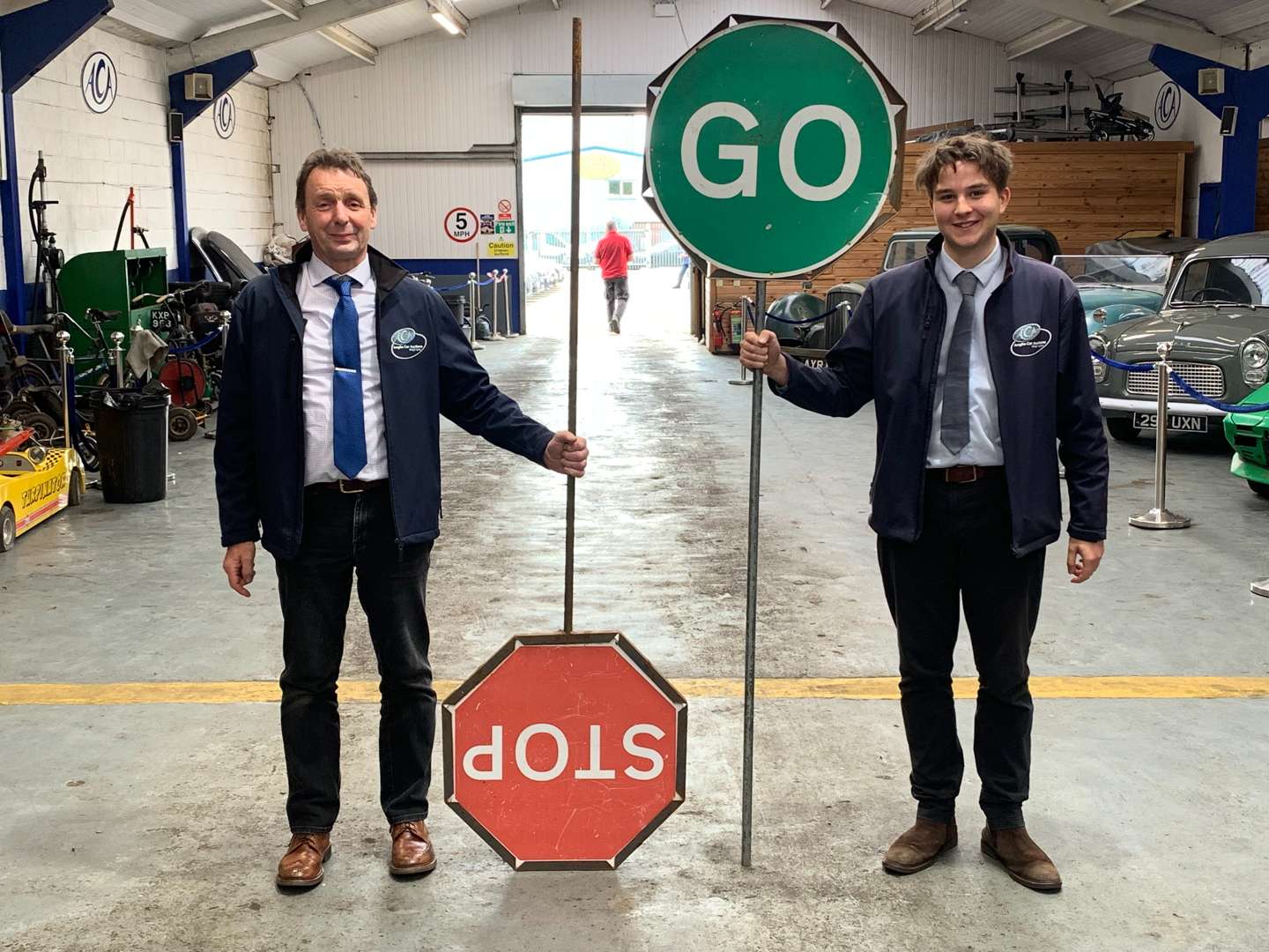 <p>Two Workmans Stop/GO Signs</p>