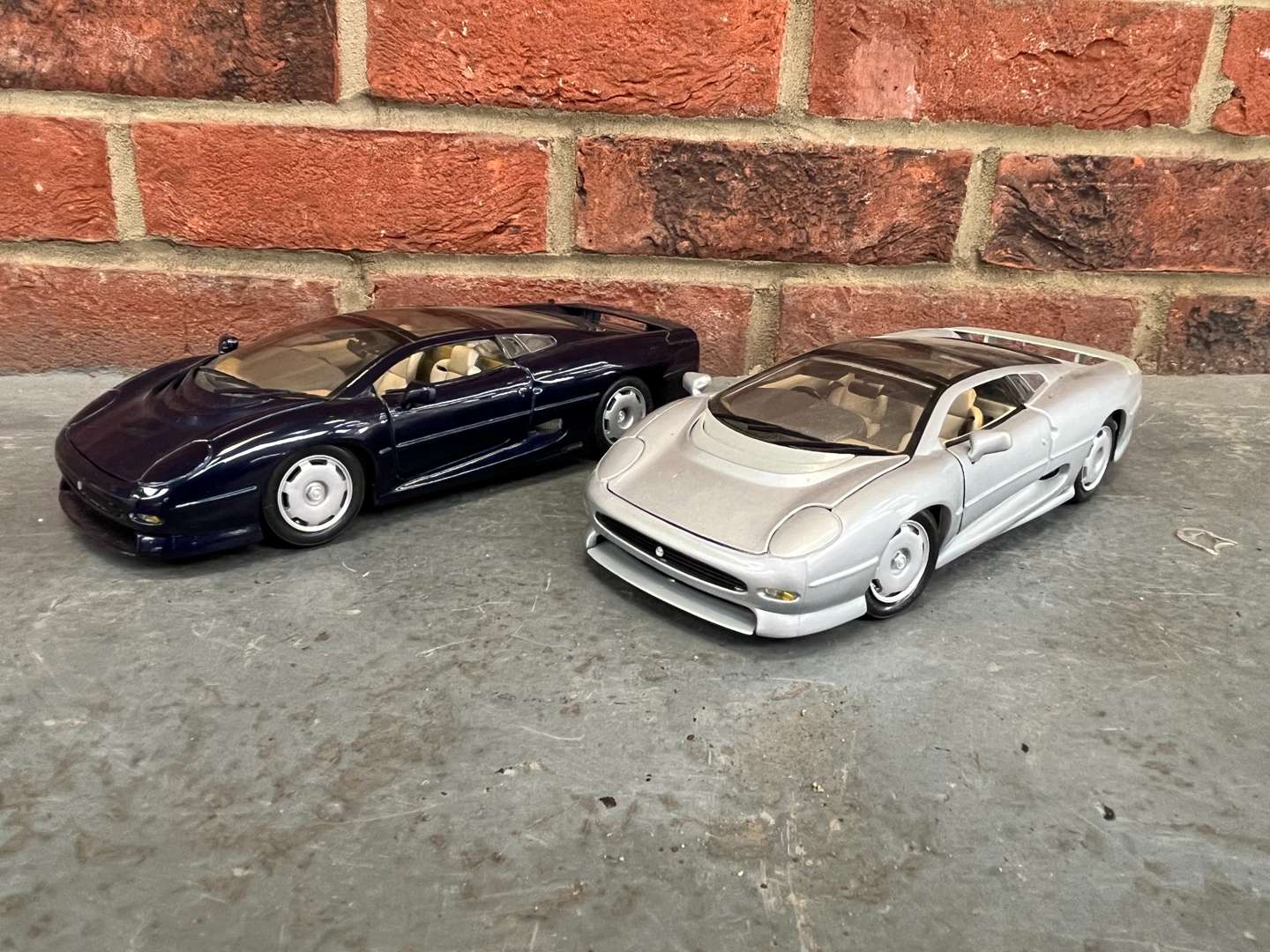 <p>Two Jaguar XJ220 Model Cars By Maisto</p>
