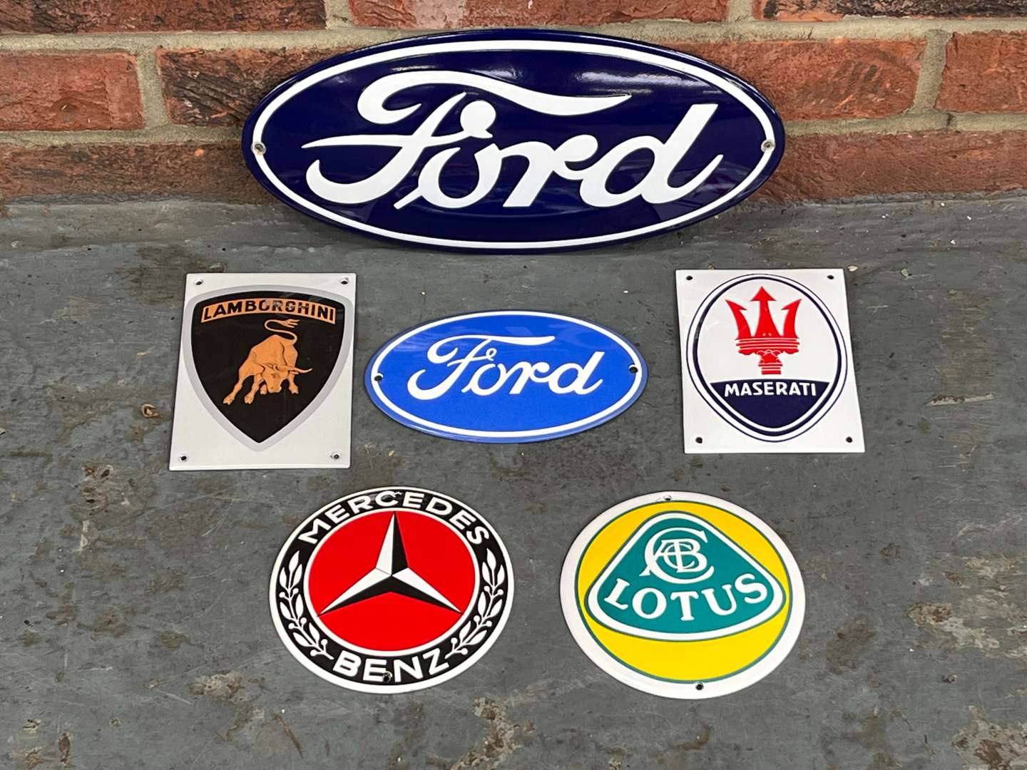 <p>Six Enamel Car Emblem Badges&nbsp;</p>