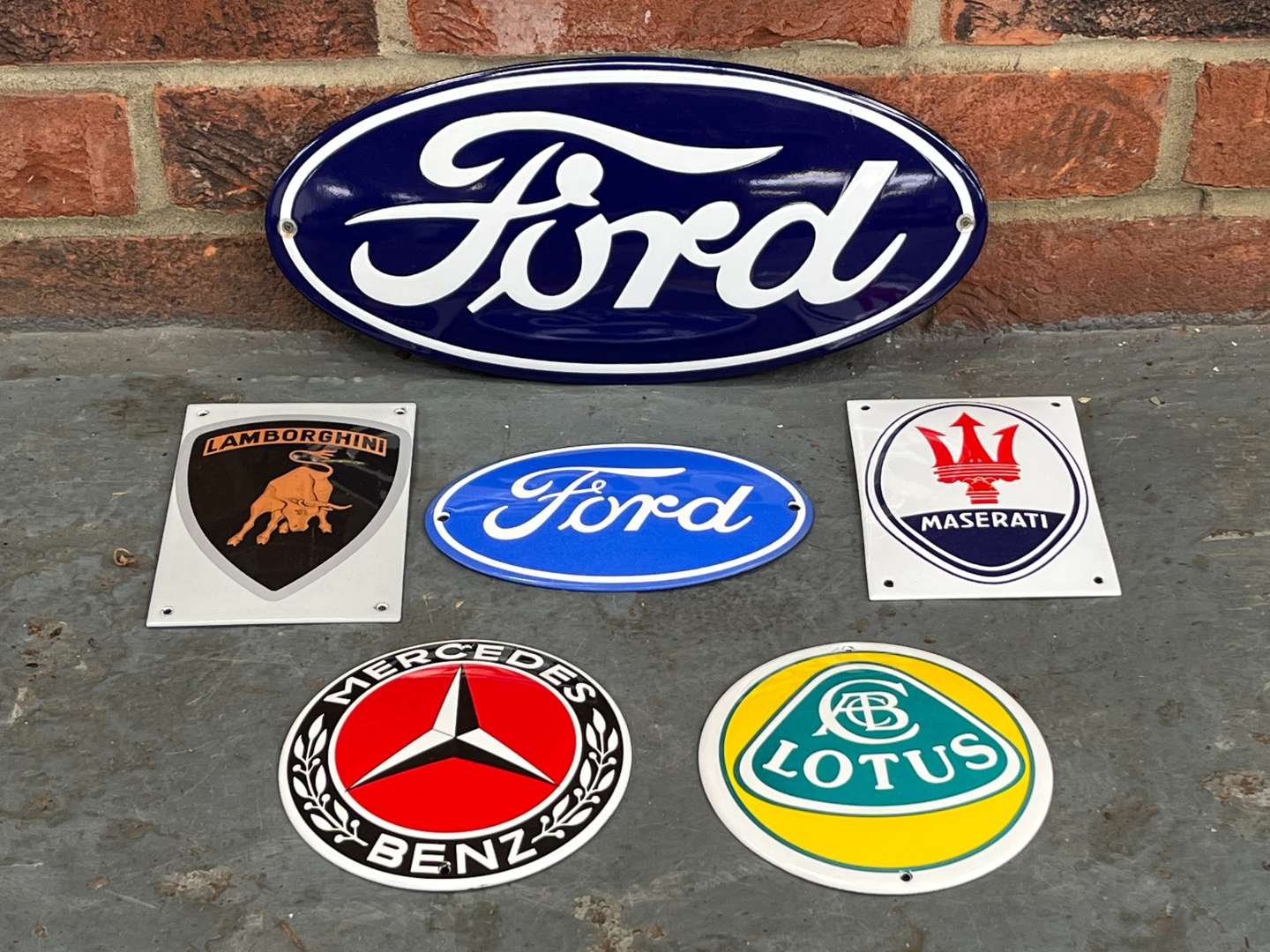 <p>Six Enamel Car Emblem Badges&nbsp;</p>