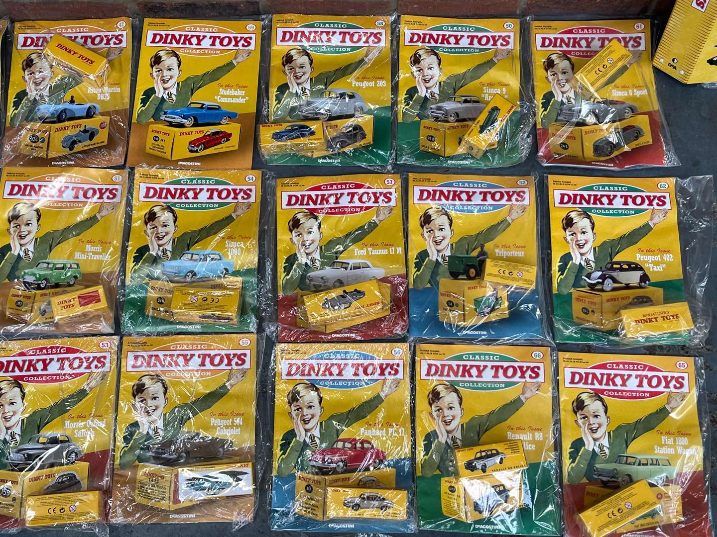 <p>Collection of Reproduction Dinky Toy Car and Magazines&nbsp;</p>