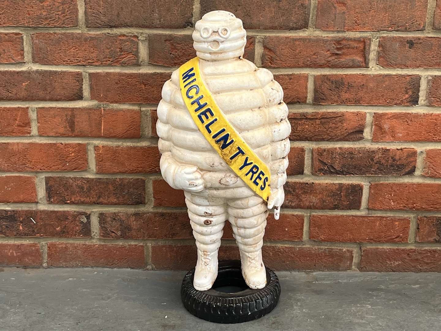 <p>Large Cast Iron Michelin Man On a Tyre</p>