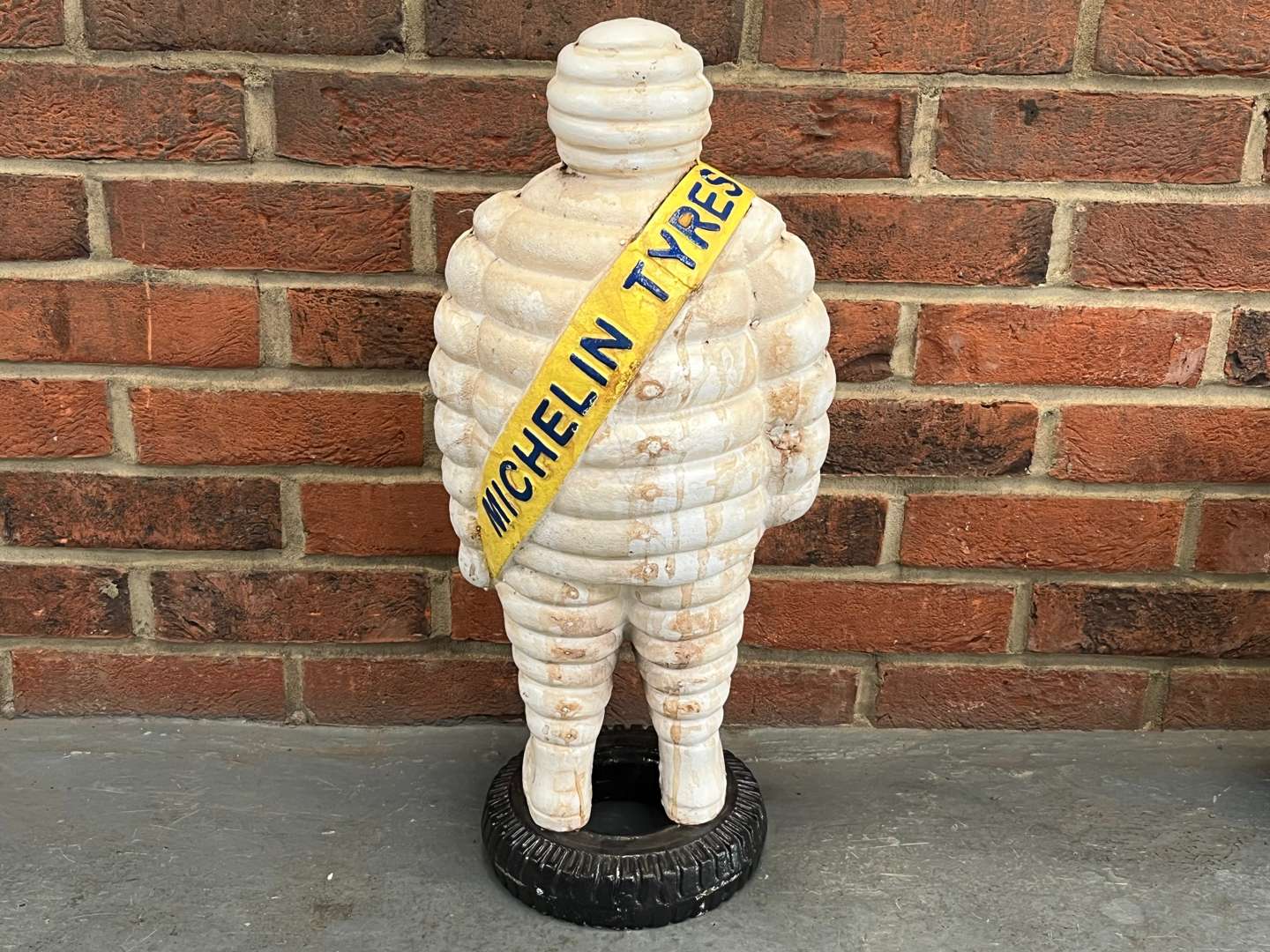 <p>Large Cast Iron Michelin Man On a Tyre</p>