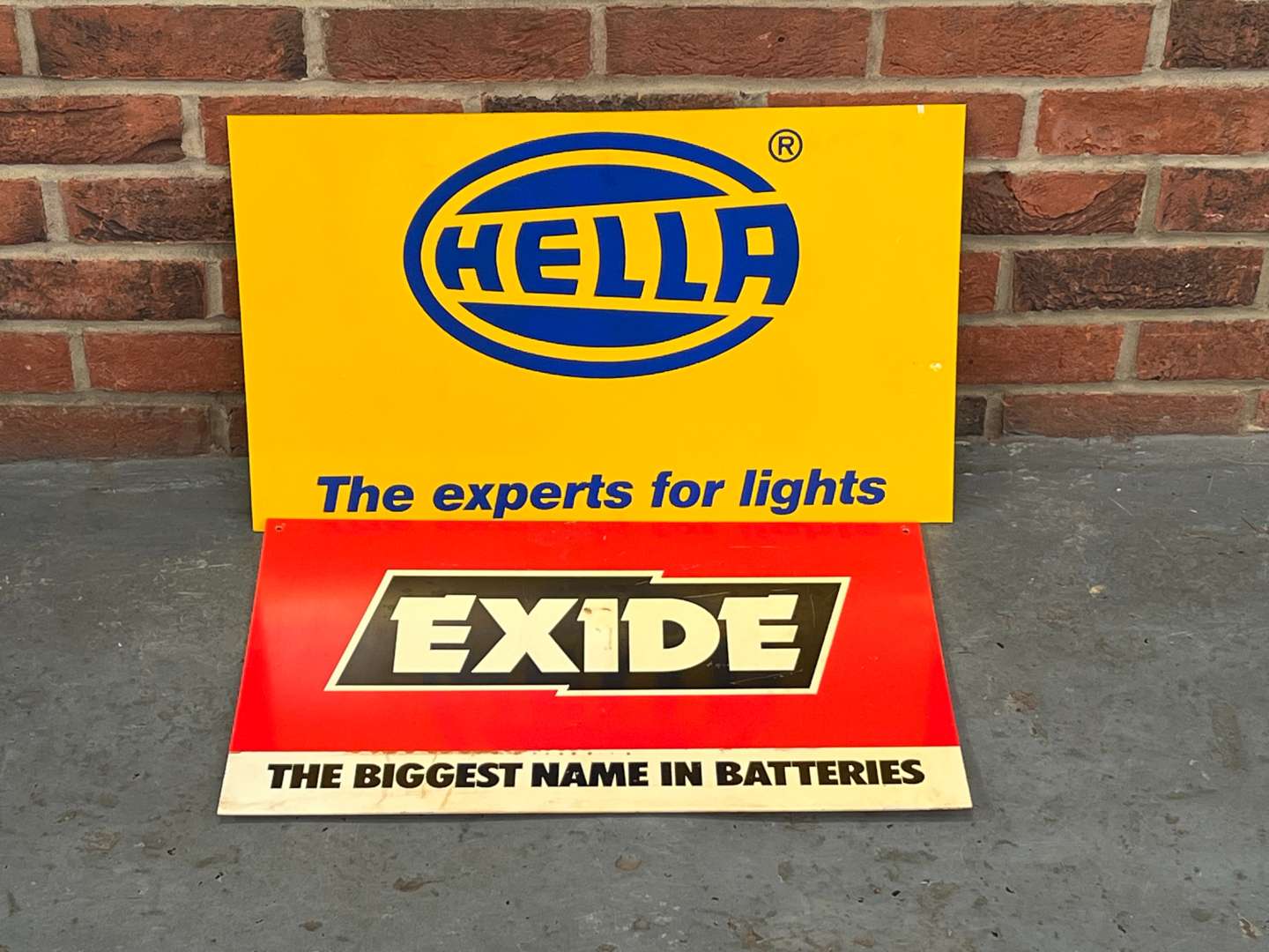 <p>Hella Lights and Exide Batteries Plastic Display Signs (2)</p>