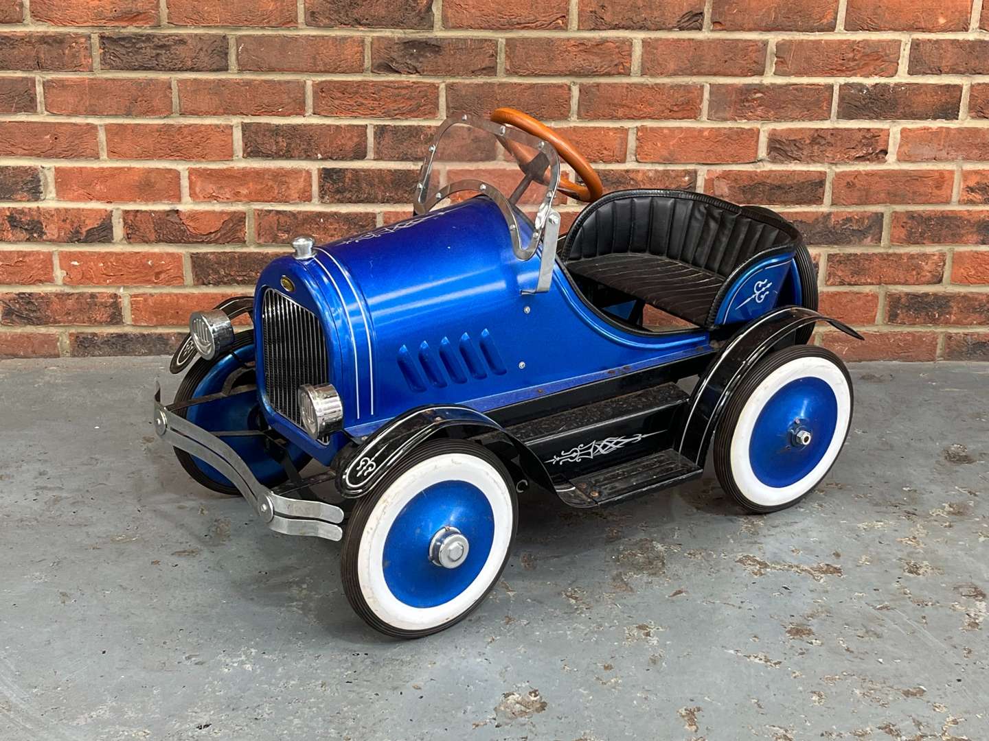 <p>Childs Tin Plate Pedal Car</p>