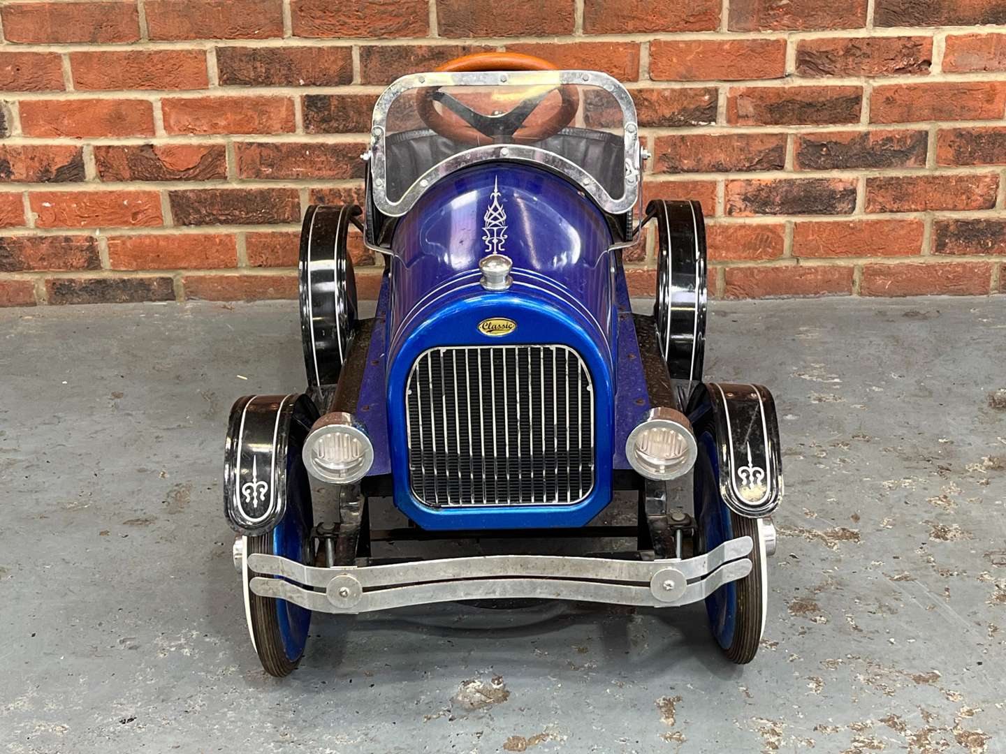 <p>Childs Tin Plate Pedal Car</p>