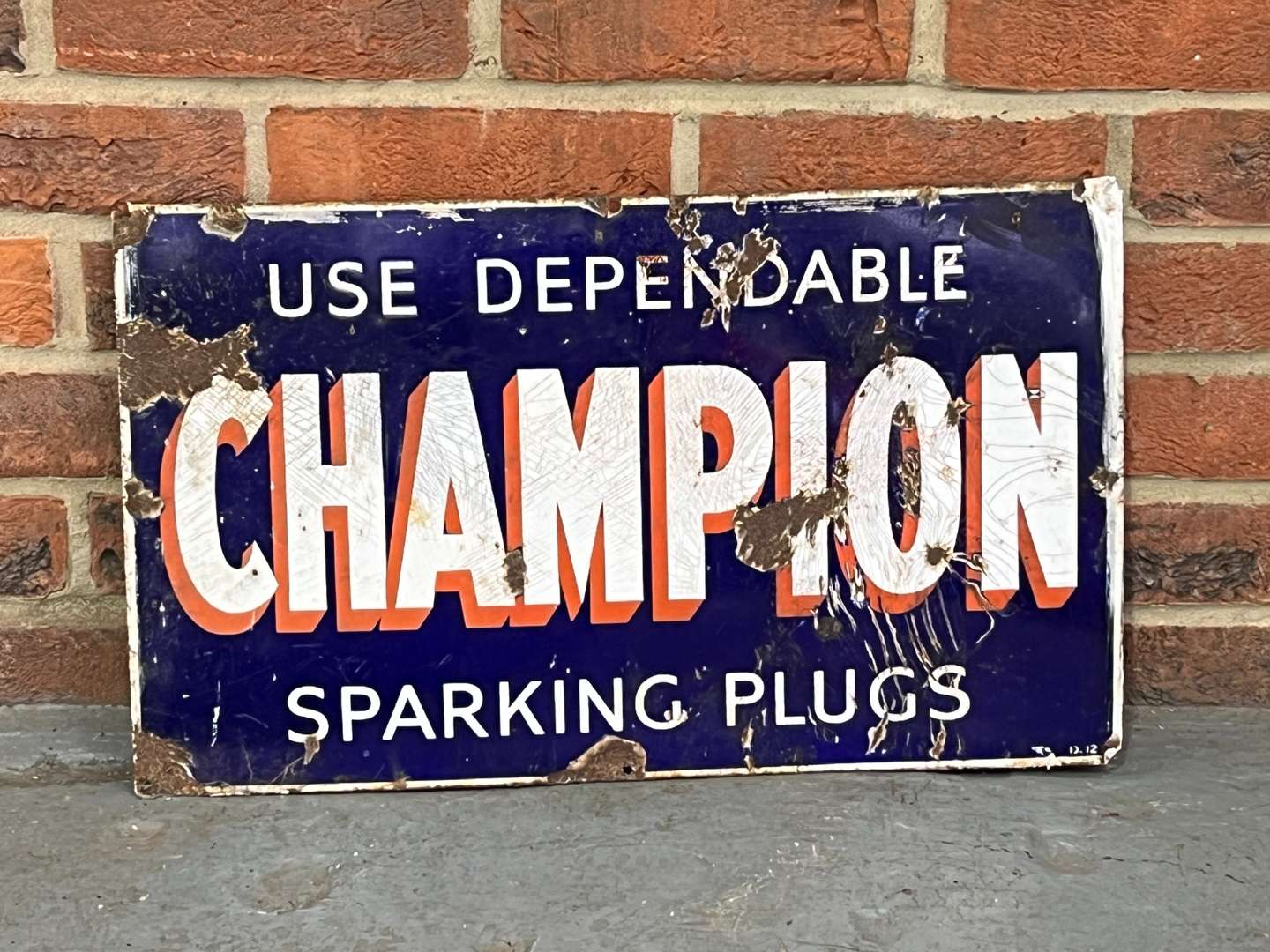 <p>Use Dependable Champion Sparking Plugs Enamel Sign</p>