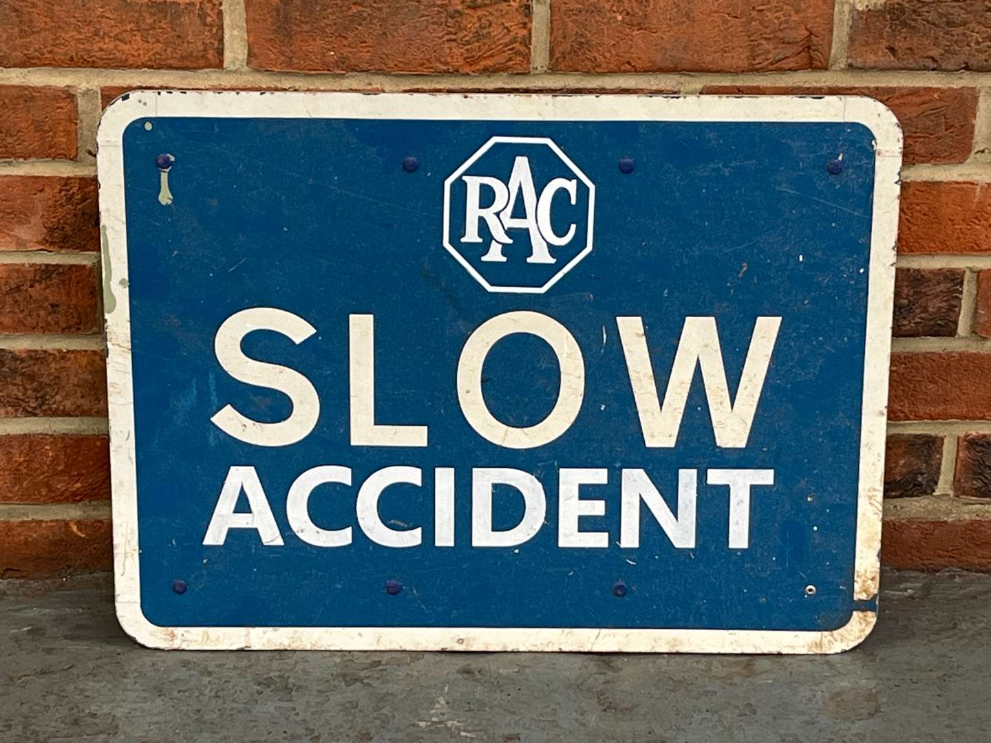 <p>RAC Slow Accident Made Sign</p>