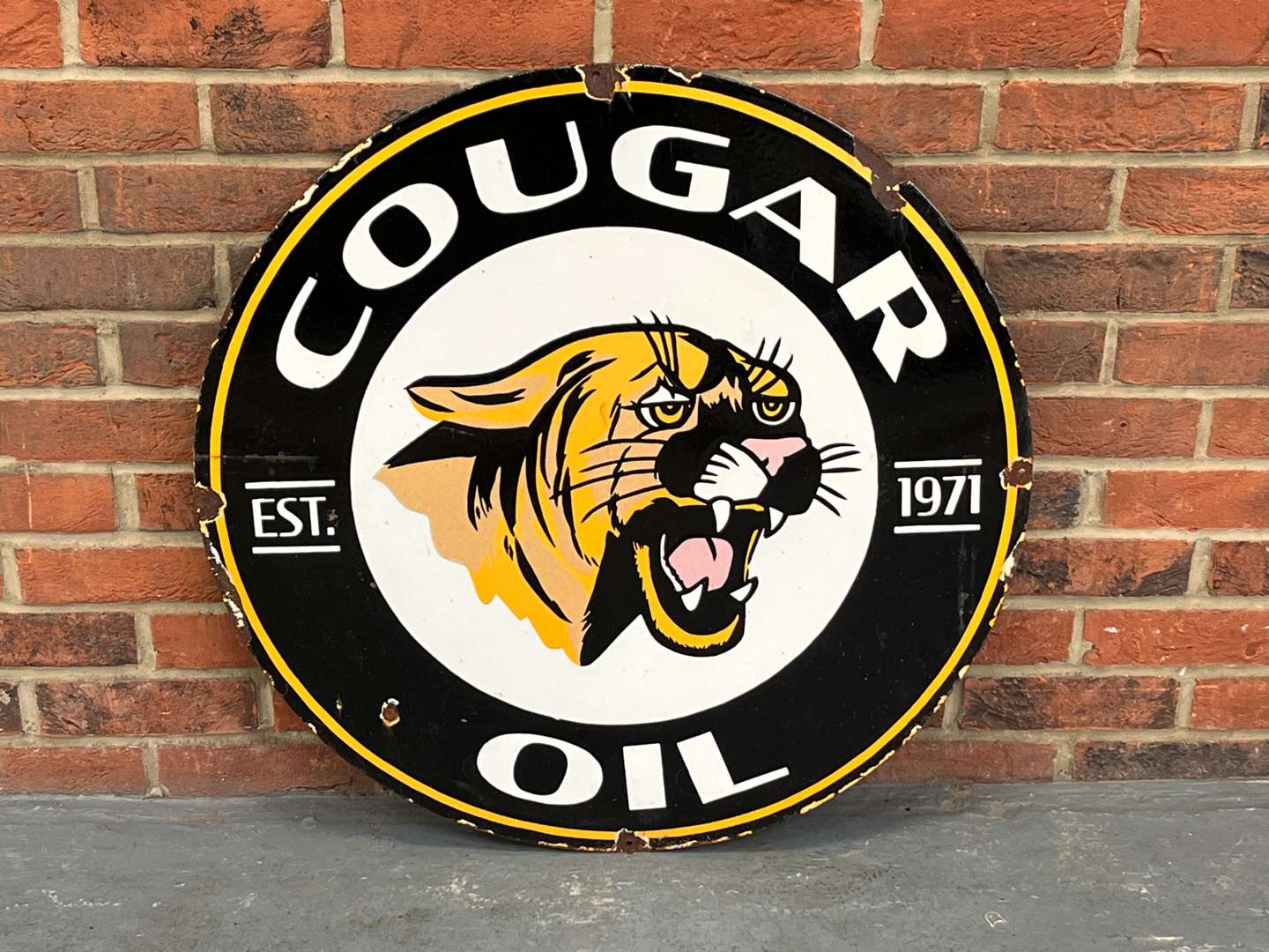 <p>Cougar Oil Circular Enamel Sign</p>