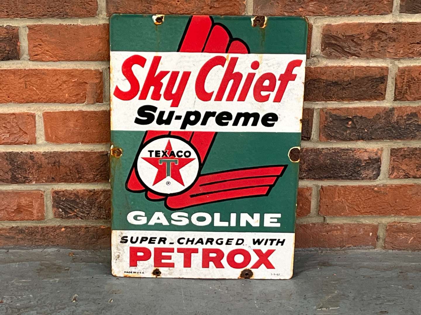 <p>Sky Chief Su-Preme Texaco Gasoline Enamel Sign</p>